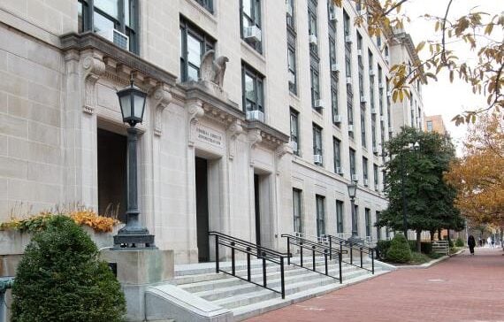 Stone facade and columned entrance of the U.S. General Services Administration headquarters in Washington, D.C.