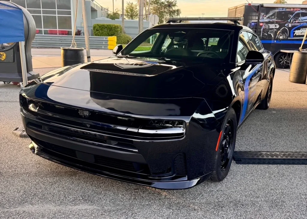 Front view of the black Dodge Charger PPV prototype with a roof-mounted light bar.