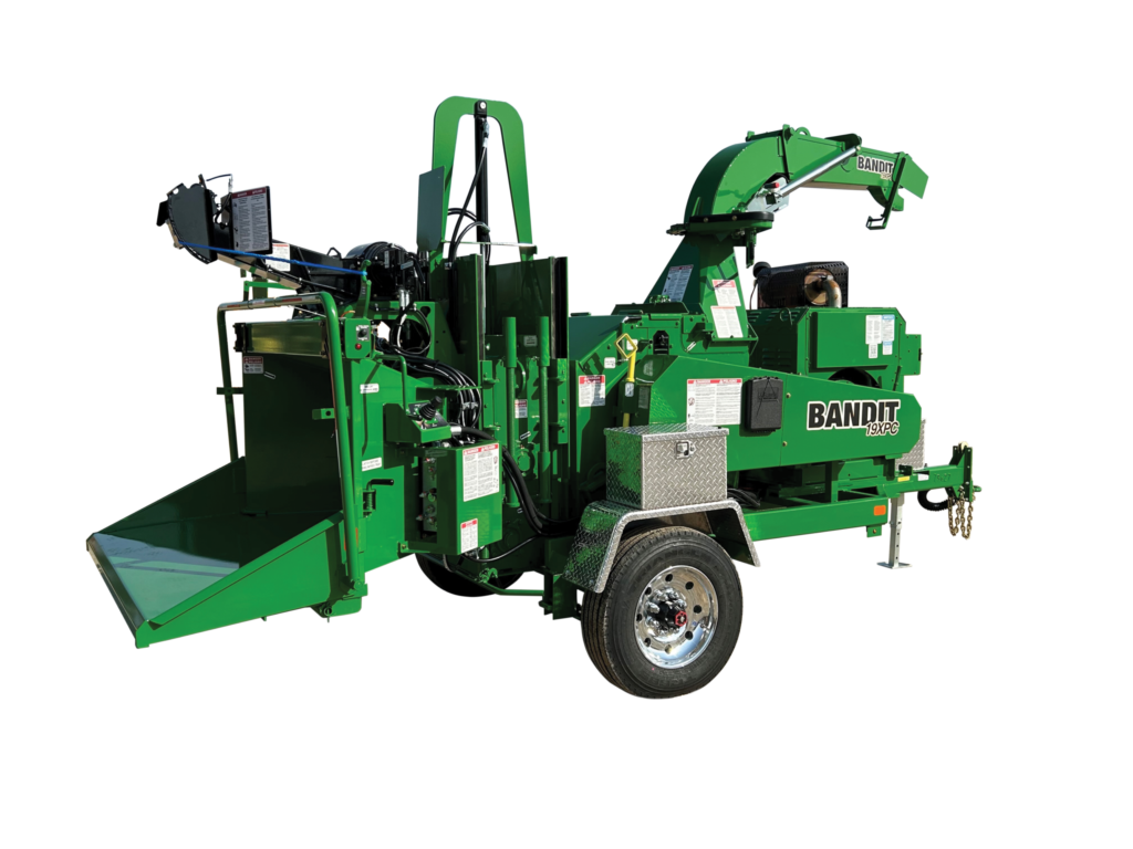 Green Bandit wood chipper trailer with hydraulic chipping mechanism and collection bin