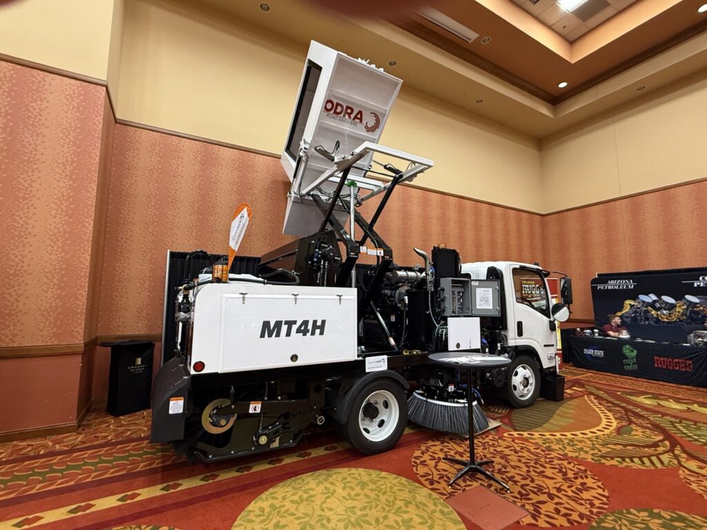 Street sweeper truck MT4H on display in hotel ballroom with signage
