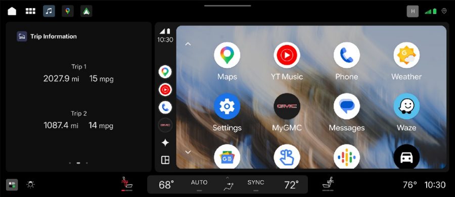Android infotainment system home screen displaying trip data and app shortcuts in vehicle