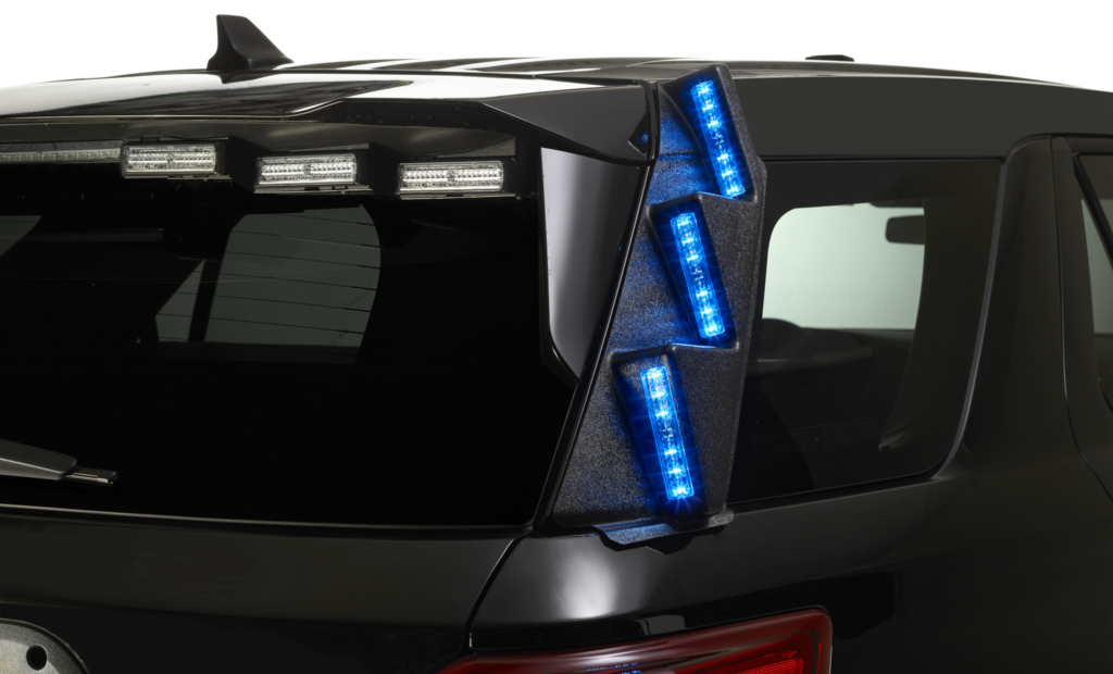 Rear view of black SUV with blue LED taillight and roof-mounted light bars