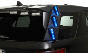 Rear view of black SUV with blue LED taillight and roof-mounted light bars