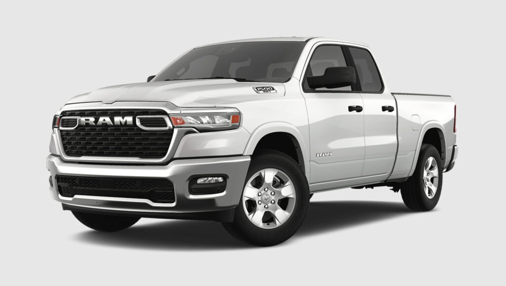 A white Ram 1500 SST crew cab pickup truck photographed from the front three-quarter angle on a plain background