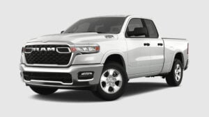 A white Ram 1500 SST crew cab pickup truck photographed from the front three-quarter angle on a plain background
