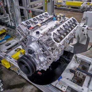 Fully assembled V-8 engine with dual overhead camshafts on factory assembly line workbench