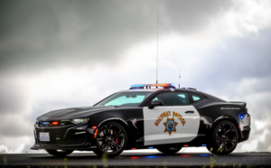 California Highway Patrol Chevrolet Camaro police car against cloudy sky
