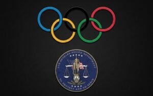 Olympic rings above Los Angeles Police Department seal on dark background