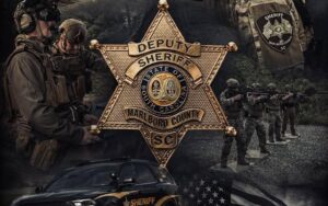 Deputy Sheriff badge for Marlboro County with armed officers and patrol vehicle composite