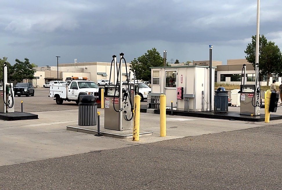 Fuel pumps at the City of Aurora fleet fuel island with a utility truck behind