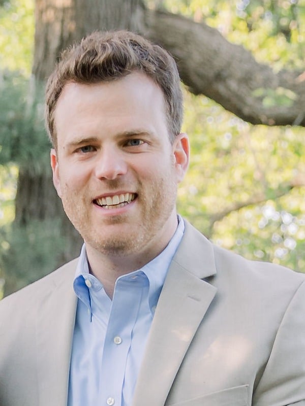 Headshot of Adam McElhinney, CEO of Uptake.