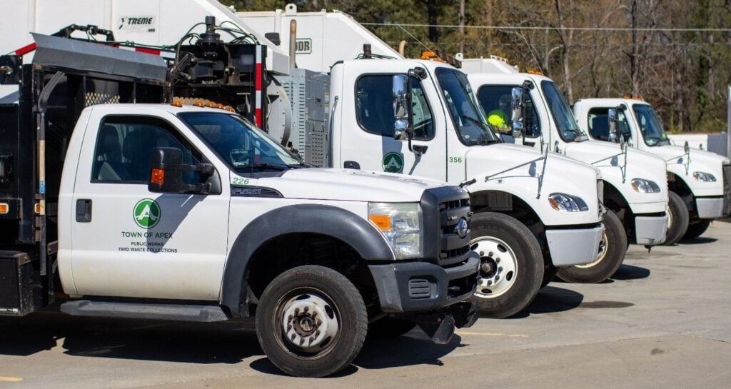 Town of Apex pickup and heavy trucks lined up in the fleet yard