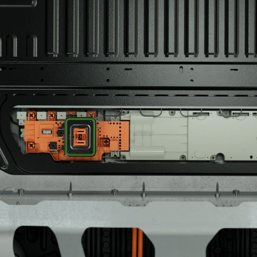 Ford Fathom E-box module with its circuit board exposed inside the vehicle structure