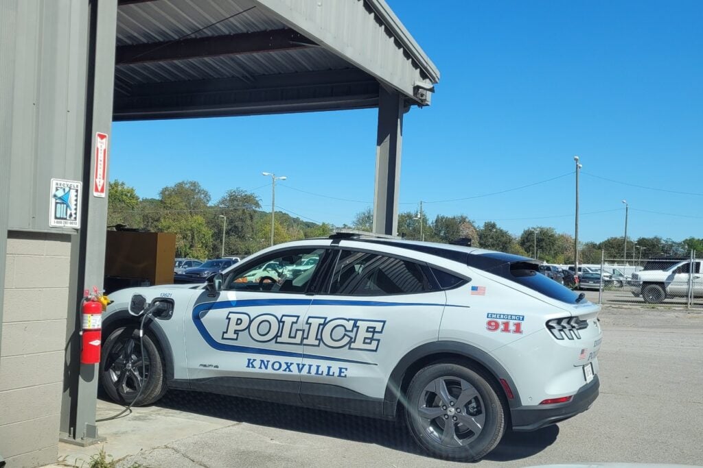 A Knoxville Police Ford Mustang Mach-E plugged in to charge