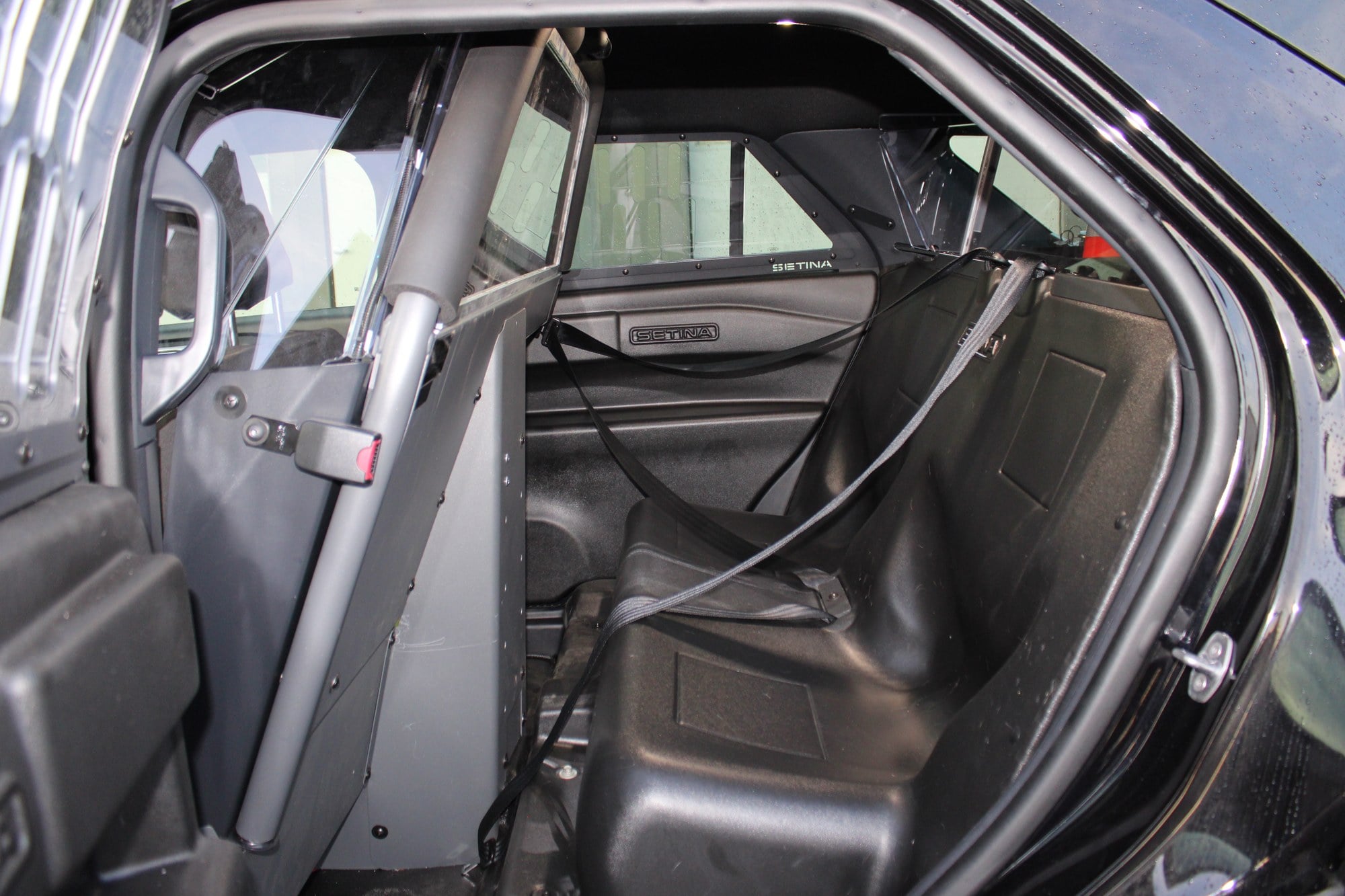 Molded rear prisoner seat behind the partition in a Salem patrol vehicle