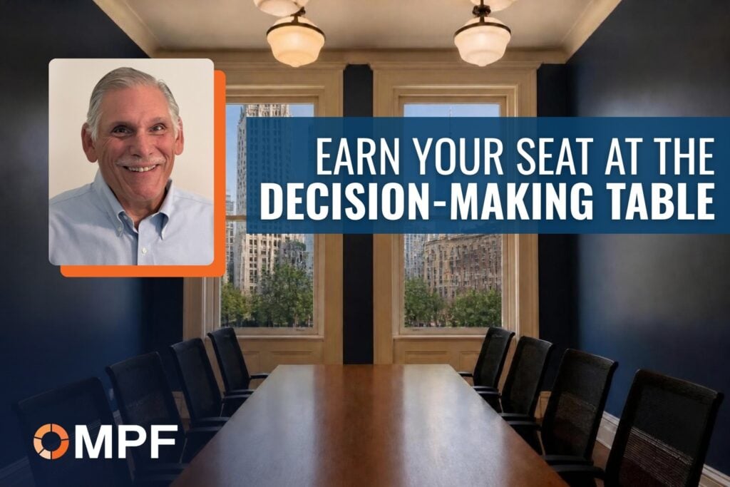 Man in blue shirt beside conference table with text "Earn Your Seat at the Decision-Making Table" and MPF logo